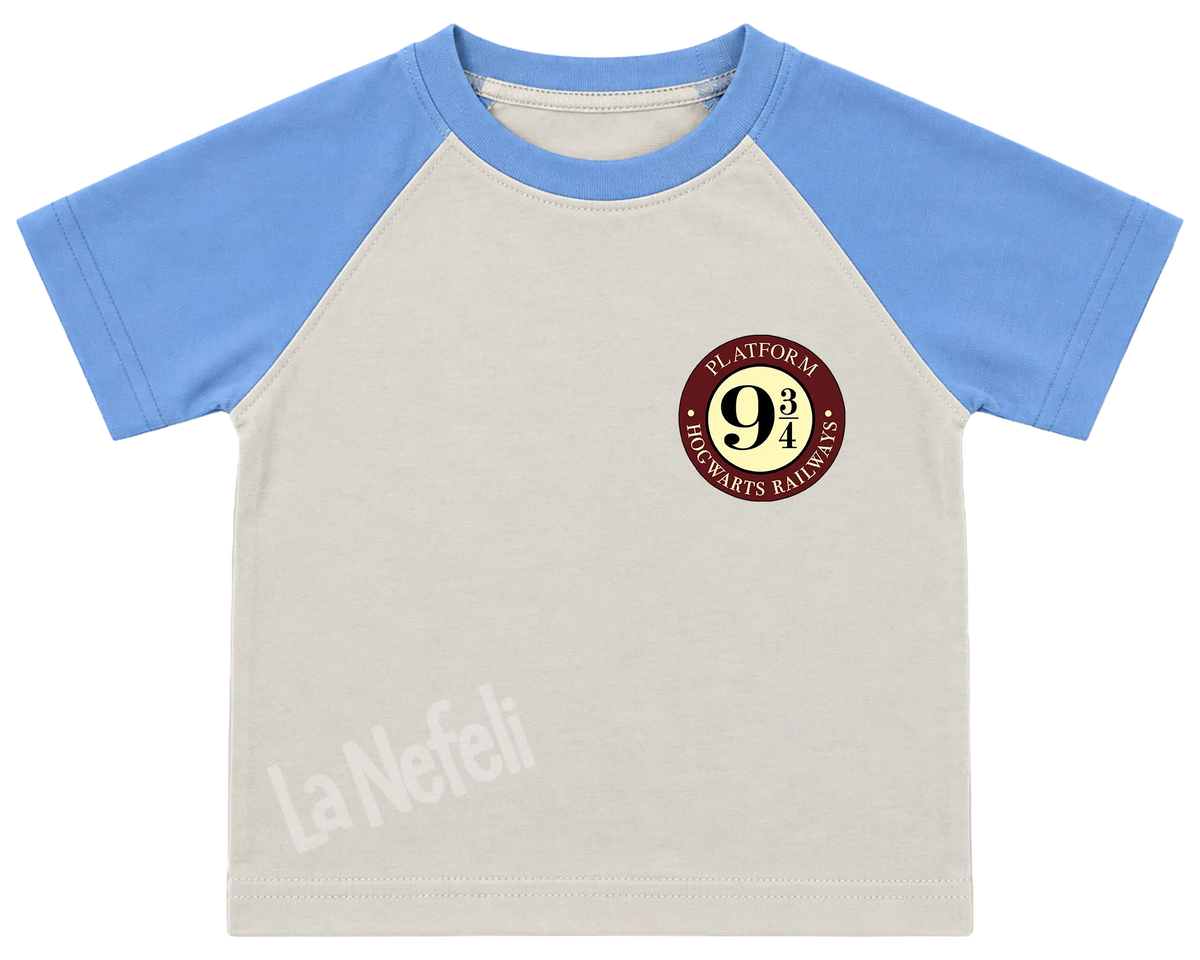 Harry Potter Hogwarts castle kids' T-shirt, raglan with blue sleeves, a small Platform 9¾ badge on the chest