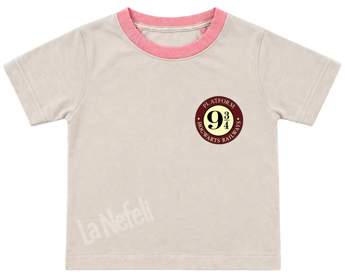 Harry Potter Hogwarts castle kids' T-shirt, cream with a pink neckline, a small Platform 9¾ badge on the chest