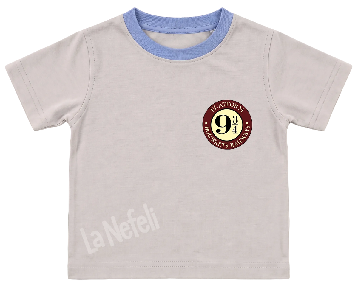 Harry Potter Hogwarts castle kids' T-shirt, cream with a blue neckline, a small Platform 9¾ badge on the chest